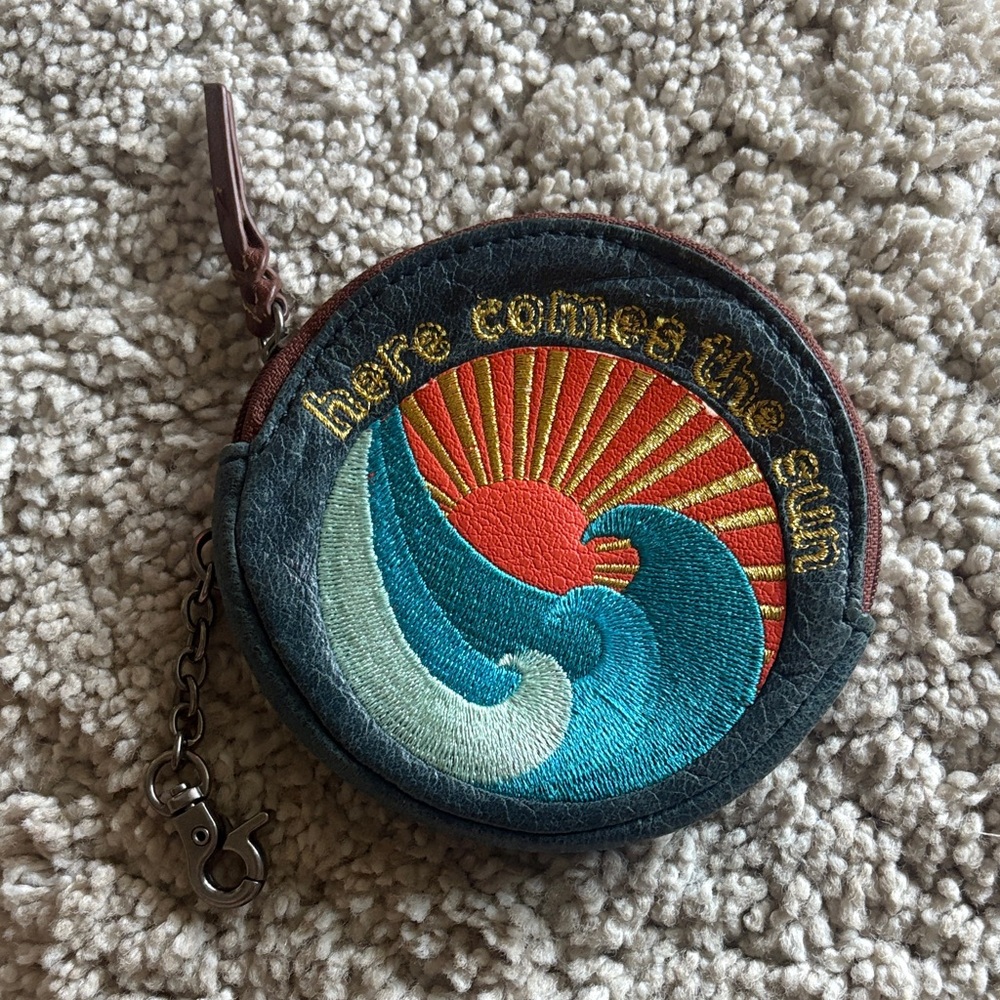 The Sak coin purse “ here comes the sun”